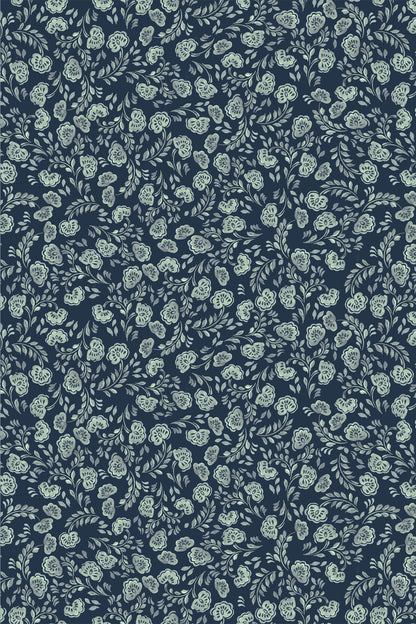 A repeating floral pattern featuring light sage green and white flowers with leaves on a dark navy blue background.