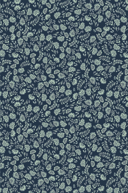 A repeating floral pattern featuring light sage green and white flowers with leaves on a dark navy blue background.