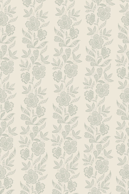 A repeating vertical floral pattern in pale sage green on a warm off-white background, shown as a flat close-up of the surface design.