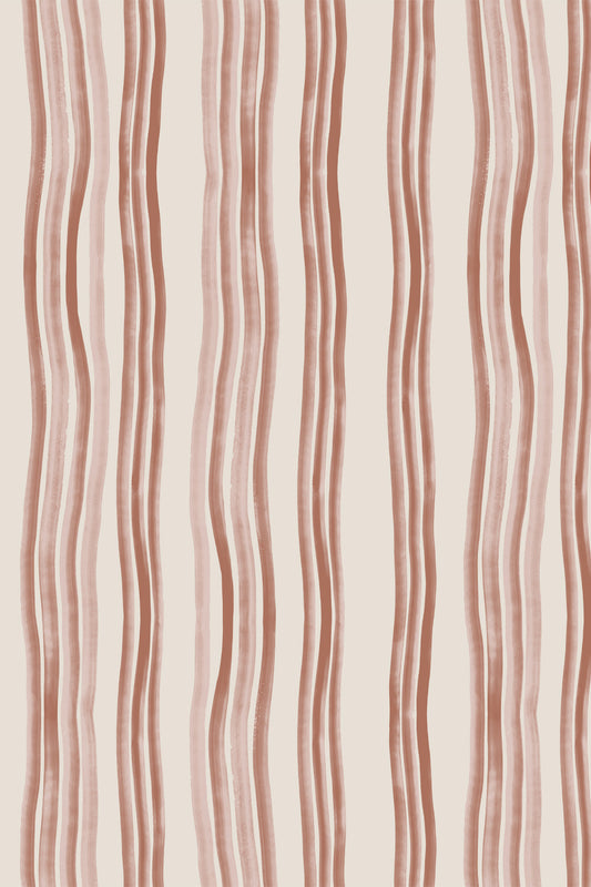 A close-up of a wallpaper or fabric pattern featuring vertical wavy stripes in a muted dusty rose-brown on a warm off-white background.