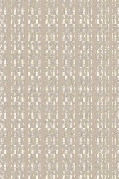 Beige fabric or wallpaper with a repeating vertical pattern of small white dots and dashes.