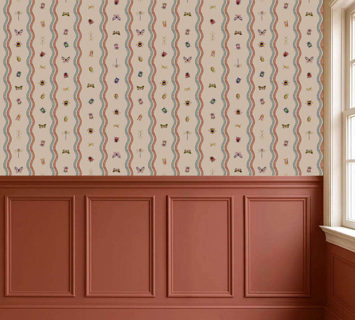 A styled interior wall showing a cream wallpaper with vertical wavy stripes and small multicolored floral motifs above reddish-brown wainscoting, with a window on the right.