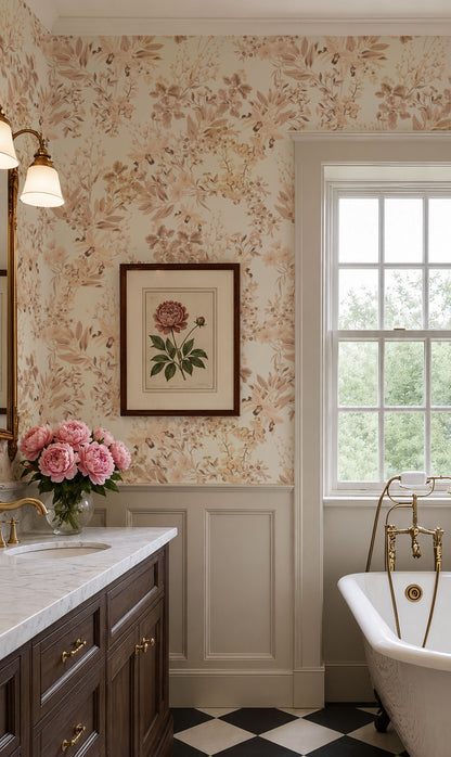 A classic vintage-style bathroom interior featuring floral wallpaper in beige and brown tones, a white wainscoted wall, a dark wood vanity with gold hardware, a window with a white frame, and a black-and-white checkered floor. A framed botanical print hangs on the wall above the sink.