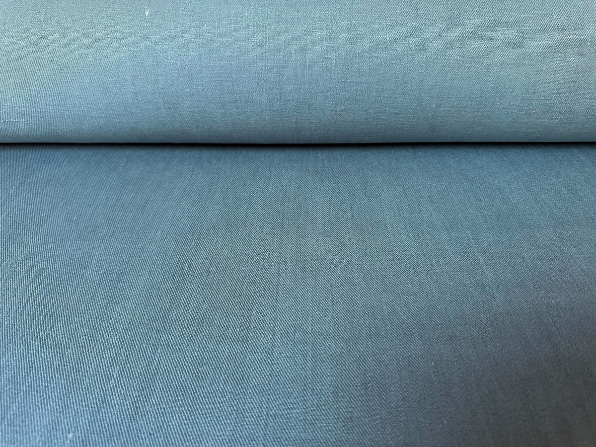 Roll of blue fabric with a textured surface