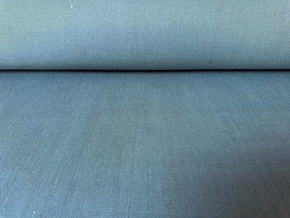 Roll of blue fabric with a textured surface