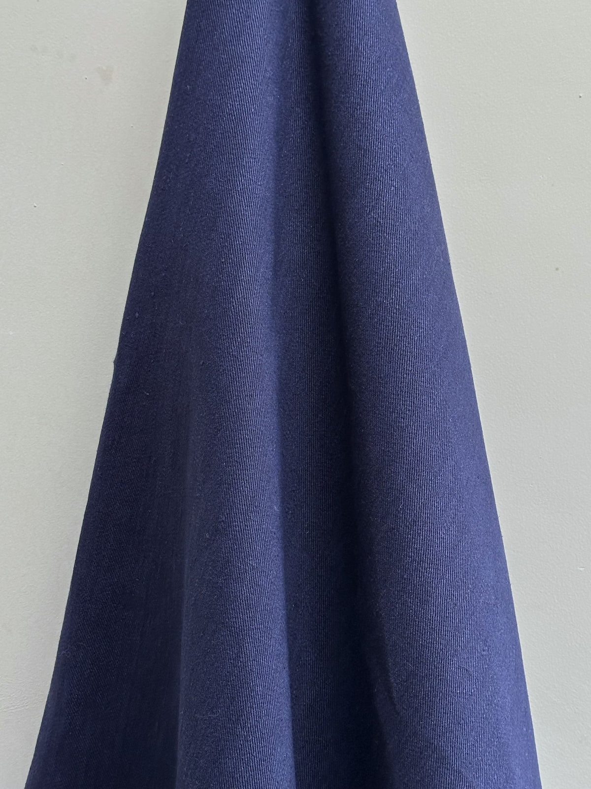 Navy blue fabric swatch on a light gray background