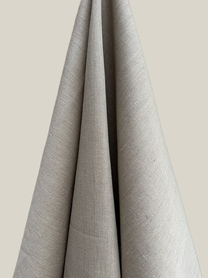 Gray fabric draped over a neutral background
