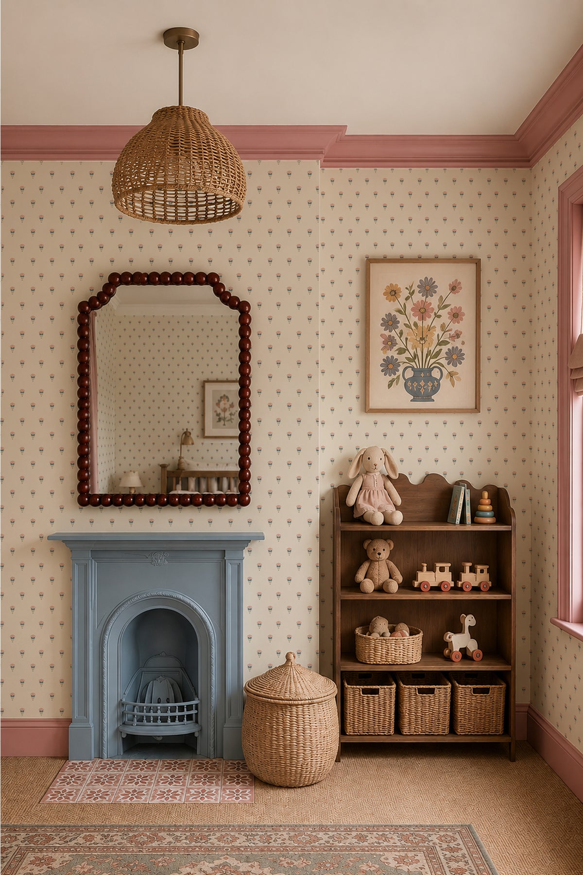 A styled nursery or children's room corner with cream wallpaper, pink trim, a blue fireplace, a woven pendant light, a wooden shelf with toys and baskets, and a patterned rug.