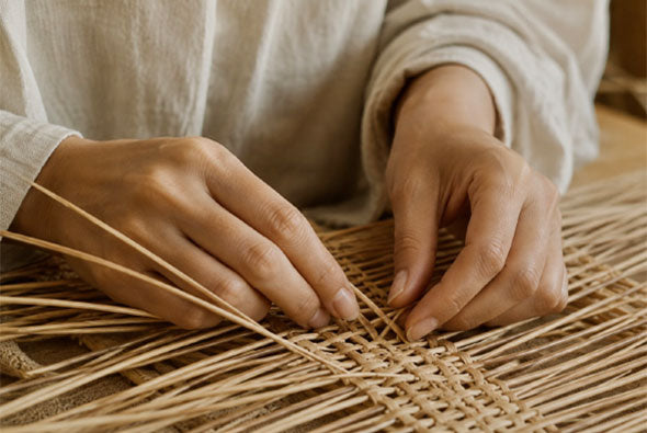 Hands weaving natural rattan by hand