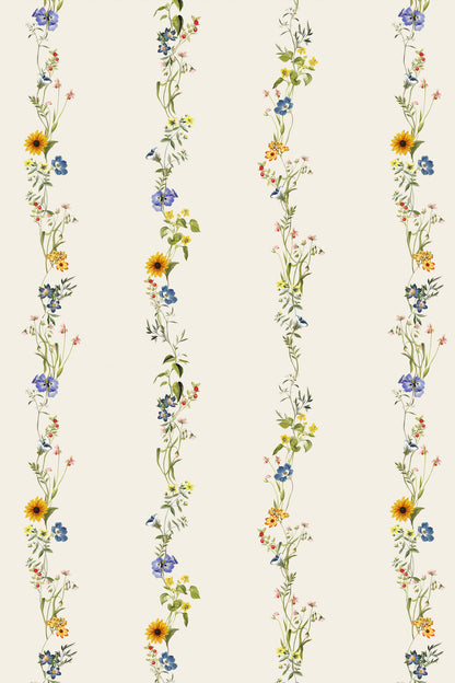 A repeating floral pattern with vertical strands of wildflowers on a warm off-white background. The flowers include yellow sunflowers, blue blossoms, and small pink and orange flowers with green stems and leaves.