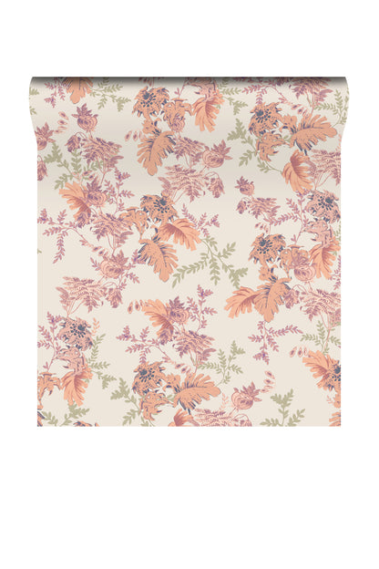 A roll of wallpaper with a vintage floral pattern in muted orange, dusty pink, sage green, and purple on a warm cream background, shown against a plain white backdrop.
