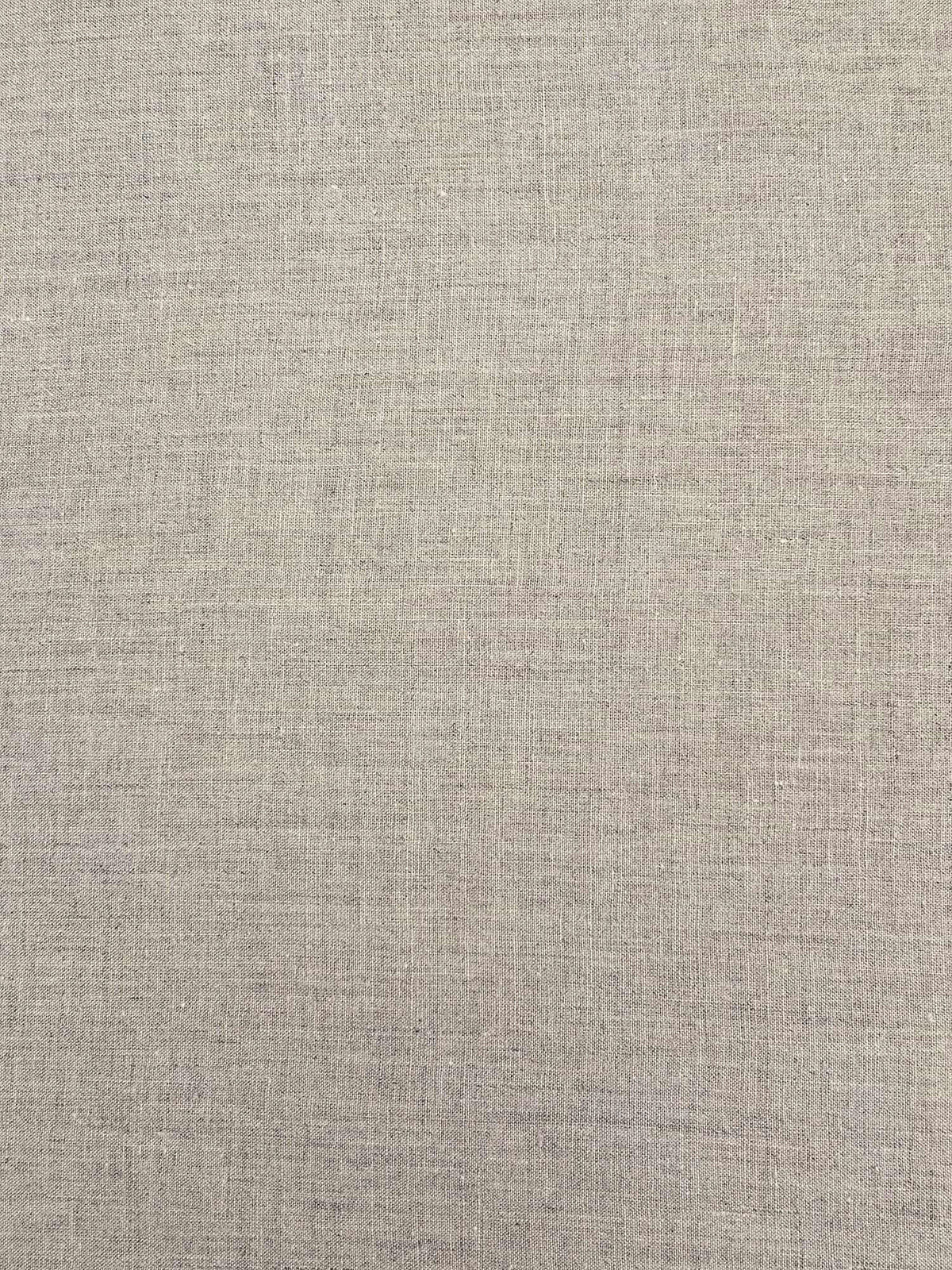A close-up of a light beige linen fabric texture with a fine woven pattern.
